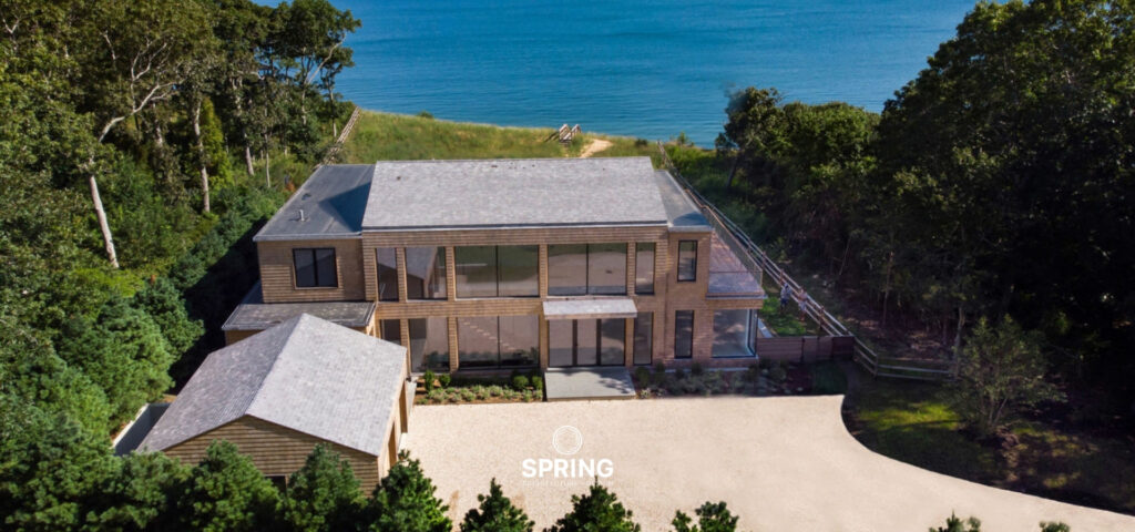 Aerial view of Bluff House in East Hampton, highlighting its coastal location and private beach access.