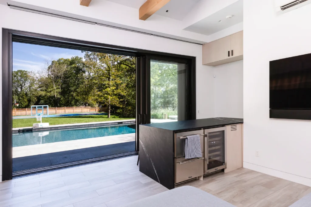 Resort House by Spring Architecture + Design, a 3,800 sq ft sustainable coastal residence featuring modern architecture, net-zero energy design, luxury outdoor living, pool house, and energy-efficient systems.