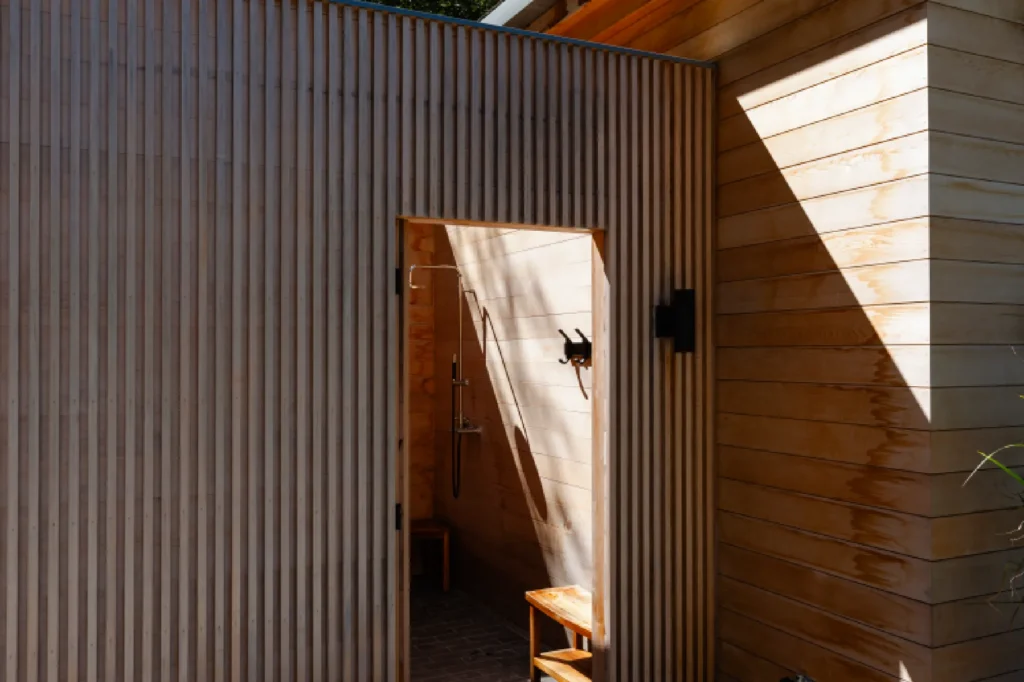 Resort House by Spring Architecture + Design, a 3,800 sq ft sustainable coastal residence featuring modern architecture, net-zero energy design, luxury outdoor living, pool house, and energy-efficient systems.